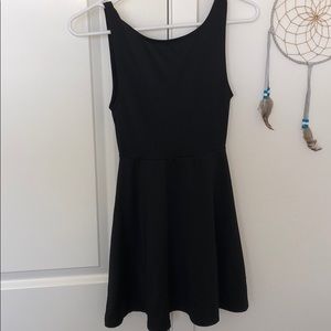 Low backed, black skater dress